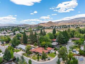 Discover this stunning property nestled in a serene, tree-lined neighborhood with breathtaking mountain views.