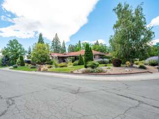Discover this charming single-story home nestled on a spacious corner lot, offering a perfect blend of comfort and style.