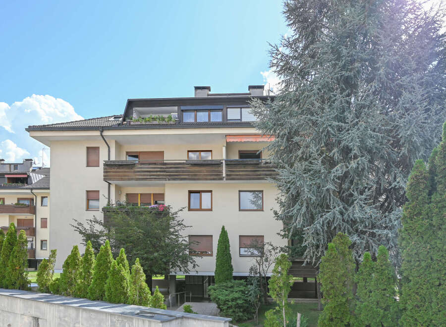 Discover modern living in this apartment building featuring spacious balconies and large windows that invite natural light.