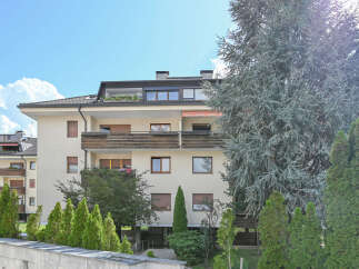 Discover modern living in this apartment building featuring spacious balconies and large windows that invite natural light.