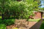 Enjoy outdoor dining in this charming brick patio area, perfect for al fresco meals.