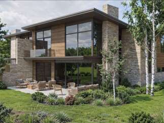 Experience modern luxury in this stunning home featuring expansive windows and natural stone accents.