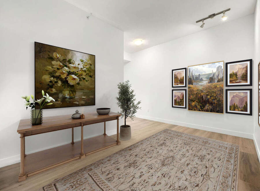 This elegant entryway features a stunning floral still life painting above a sleek console table, complemented by a modern potted tree.