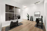 Elevate your fitness routine in this dedicated home gym, featuring a stationary bike and a versatile weight machine.