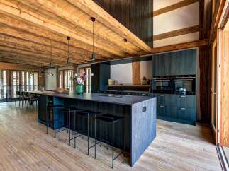 Experience luxury mountain living in this stunning open-plan kitchen and dining area.