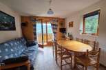 Experience breathtaking mountain views from this charming living and dining area.