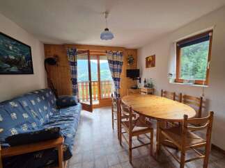 Experience breathtaking mountain views from this charming living and dining area.