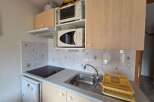 Discover this compact kitchen, perfect for small spaces.