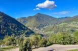 Experience breathtaking mountain views from this stunning property, nestled in a serene valley surrounded by lush forests.