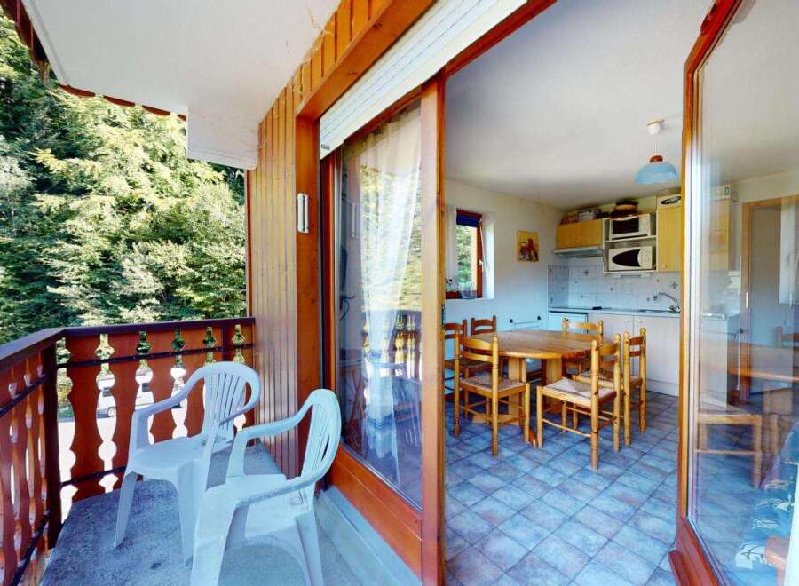 Enjoy the serene mountain views from this charming balcony, perfect for your morning coffee or evening relaxation.