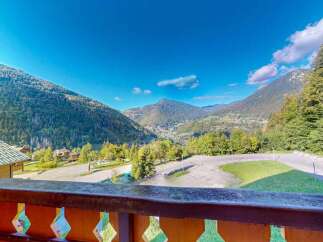 Experience breathtaking mountain views from this property, offering a serene escape amidst lush greenery and majestic peaks.