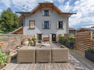Experience outdoor living at its finest on this expansive wooden deck, perfect for entertaining or relaxing.