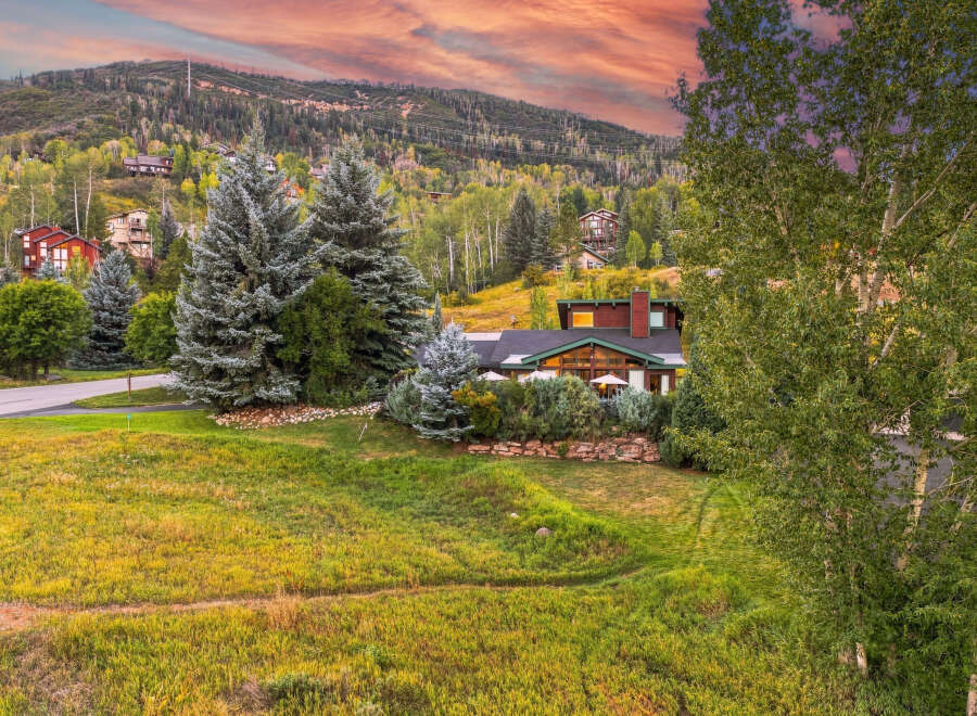 Nestled amidst a vibrant mountain landscape, this stunning property offers breathtaking views and a serene atmosphere.
