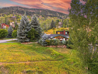 Nestled amidst a vibrant mountain landscape, this stunning property offers breathtaking views and a serene atmosphere.