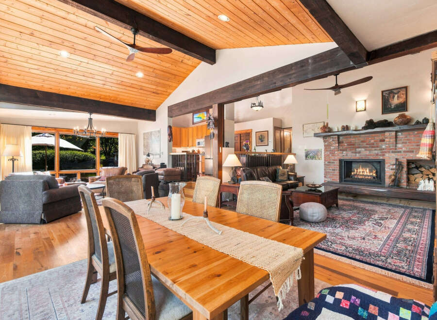 Experience rustic charm and modern comfort in this spacious living and dining area.