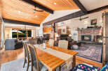 Experience rustic charm and modern comfort in this spacious living and dining area.