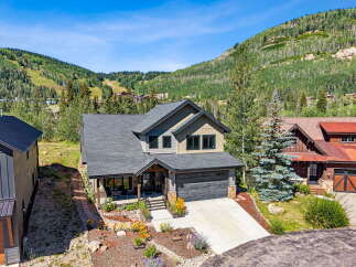 Nestled against a stunning mountain backdrop, this exquisite home offers the perfect blend of luxury and natural beauty.