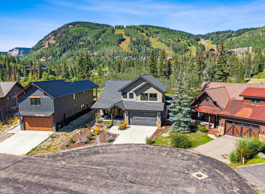 Experience luxury mountain living with these stunning homes nestled against a backdrop of majestic peaks and ski slopes.