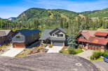Experience luxury mountain living with these stunning homes nestled against a backdrop of majestic peaks and ski slopes.