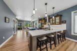 Experience luxury and comfort in this stunning kitchen, featuring a spacious island with ample seating and a sleek, modern design.
