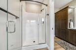 Step into this beautifully appointed bathroom featuring a spacious, modern shower with a glass enclosure and sleek fixtures.
