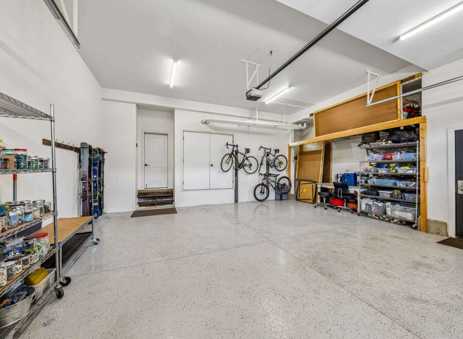 Discover ample storage and organization in this spacious garage, perfect for any homeowner.