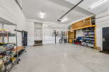 Discover ample storage and organization in this spacious garage, perfect for any homeowner.