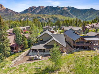 Nestled amidst a picturesque mountain landscape, this stunning property offers breathtaking views and luxurious living.