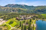 Nestled amidst a lush forest and majestic mountains, this property offers a serene escape with a beautiful lake and a charming neighborhood.