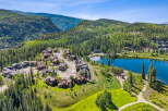 Nestled amidst a lush alpine forest, this stunning property offers breathtaking mountain views and a serene lakeside setting.
