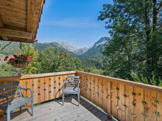 Enjoy breathtaking mountain views from this charming balcony, perfect for morning coffee or evening relaxation.