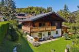 Experience alpine charm in this stunning wooden chalet, featuring a spacious balcony perfect for enjoying mountain views.