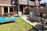 Enjoy outdoor living in this charming property featuring a spacious wooden deck perfect for al fresco dining and relaxation.
