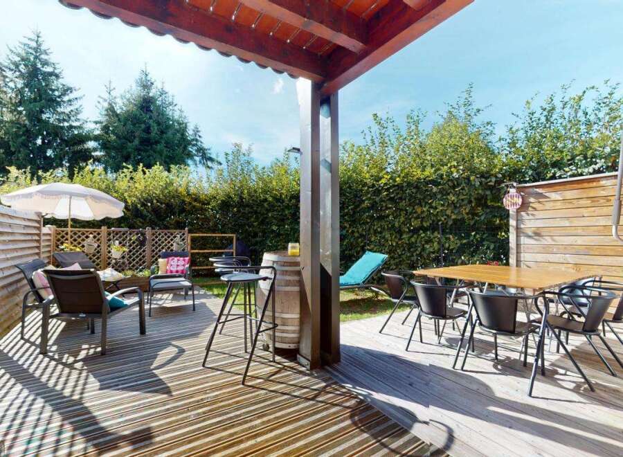 Enjoy outdoor living with this spacious deck, perfect for entertaining or relaxing.