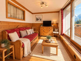 Experience cozy mountain living in this charming alpine-style living room, featuring a rustic wooden sofa with red cushions and decorative pillows.