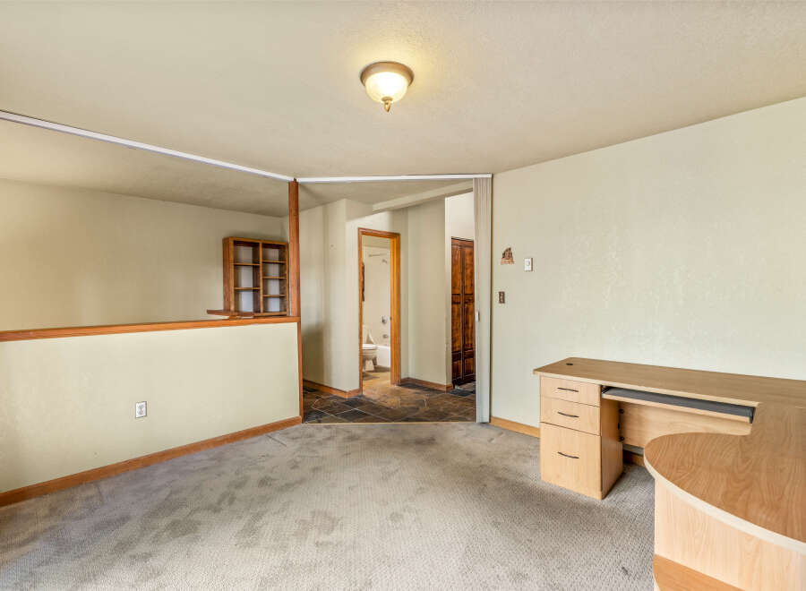 Discover a versatile space perfect for a home office or additional living area.