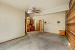 Discover this charming space featuring a built-in wet bar with rich wooden cabinetry, perfect for entertaining.