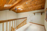 Ascend to the upper level of this charming home via a beautifully crafted wooden staircase, leading to a spacious landing.