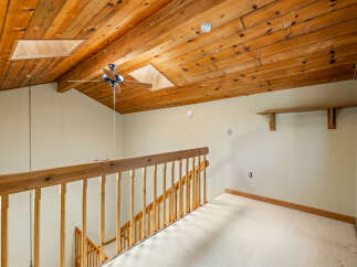 Ascend to the upper level of this charming home via a beautifully crafted wooden staircase, leading to a spacious landing.