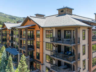Experience luxury mountain living in this stunning condominium complex, featuring expansive balconies with breathtaking views and modern amenities.