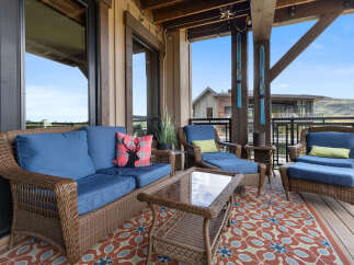 Enjoy the stunning mountain views from this spacious covered deck, perfect for outdoor entertaining or relaxing.
