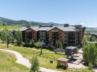Experience luxury mountain living in this stunning condominium complex, nestled amidst breathtaking natural beauty.