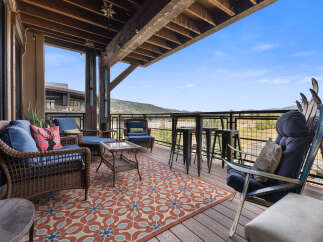 Enjoy breathtaking mountain views from this expansive deck, perfect for entertaining or relaxing.