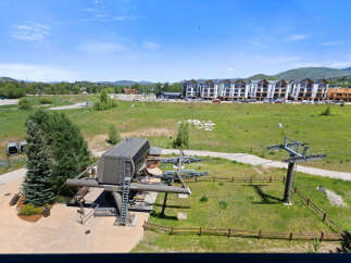 Experience the ultimate mountain lifestyle with this stunning property featuring a modern ski lift station and gondolas, perfect for accessing the slopes.