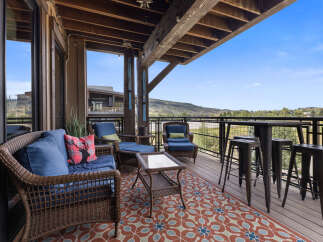 Enjoy breathtaking mountain views from this spacious covered deck, perfect for outdoor entertaining.
