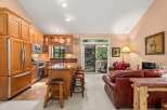 This open-concept living space seamlessly blends a gourmet kitchen with a cozy living area, perfect for entertaining.