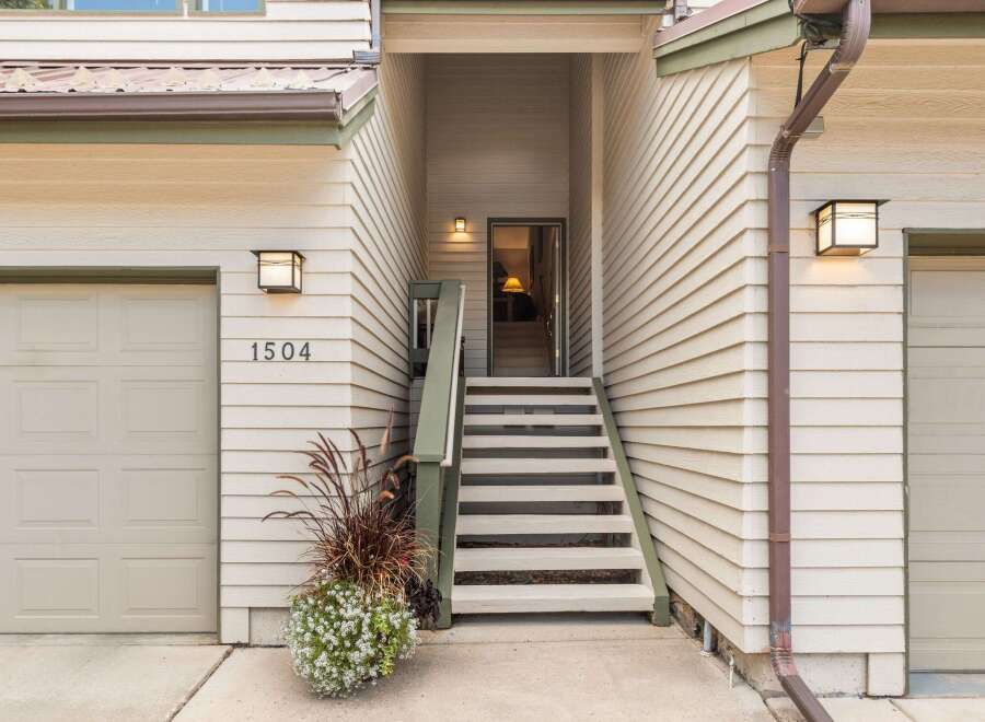 Welcome to this charming property featuring a well-maintained exterior with beige siding and a brown metal roof.
