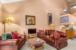 Experience rustic charm in this inviting living room, featuring plush leather sofas and a cozy stone coffee table.