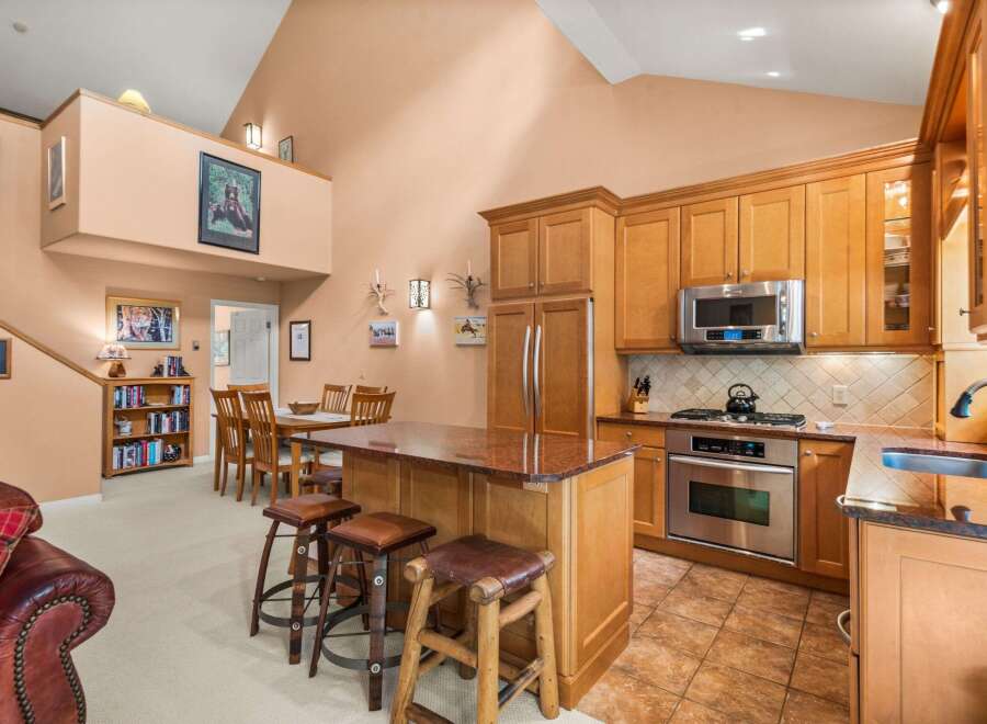 Experience the perfect blend of rustic charm and modern convenience in this stunning kitchen and dining area.