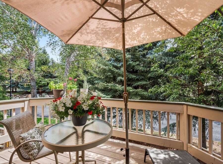 Enjoy the serene mountain views from this charming deck, perfect for outdoor dining or relaxation.